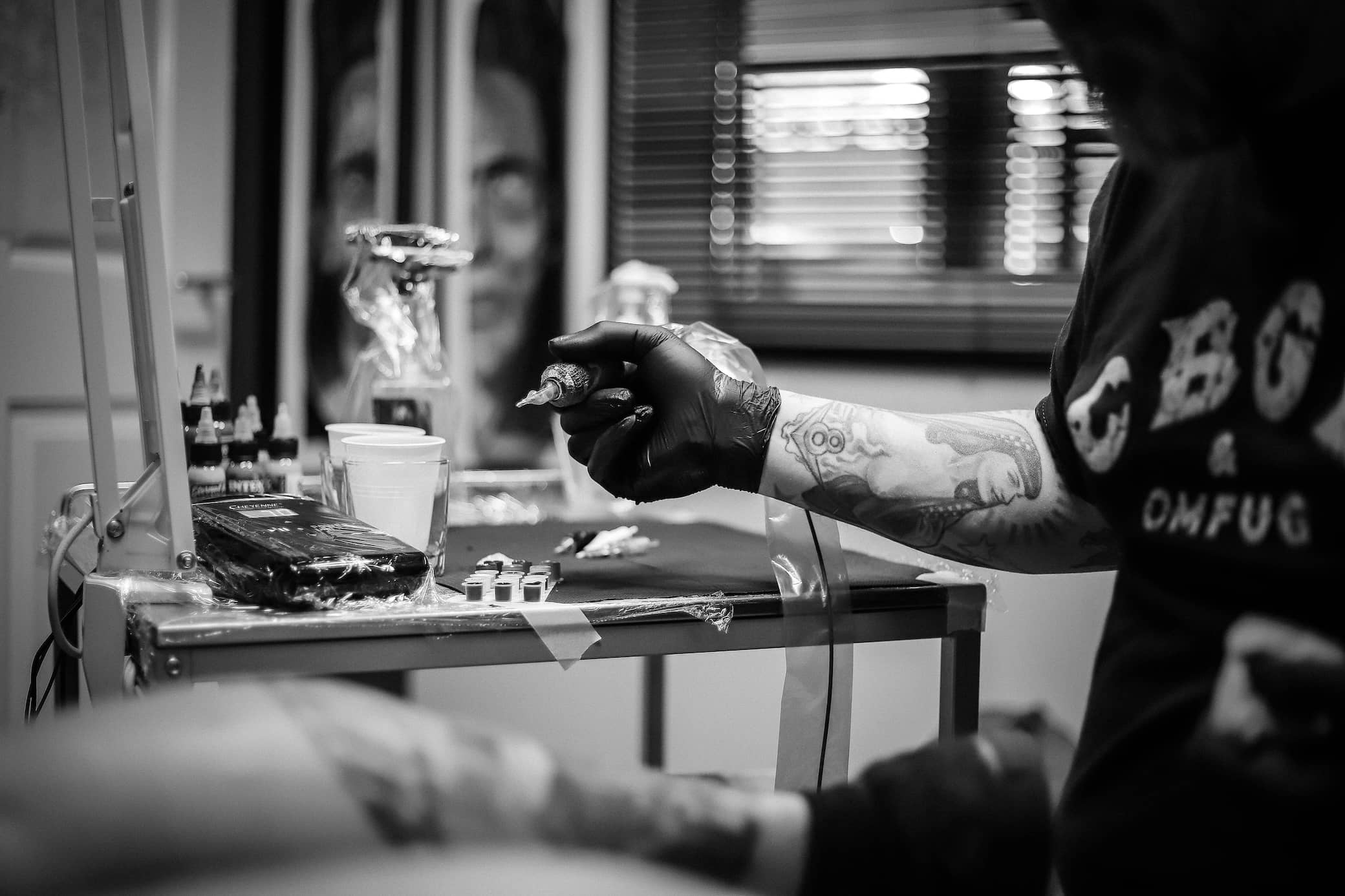 Professional tattoo artist at work in their studio