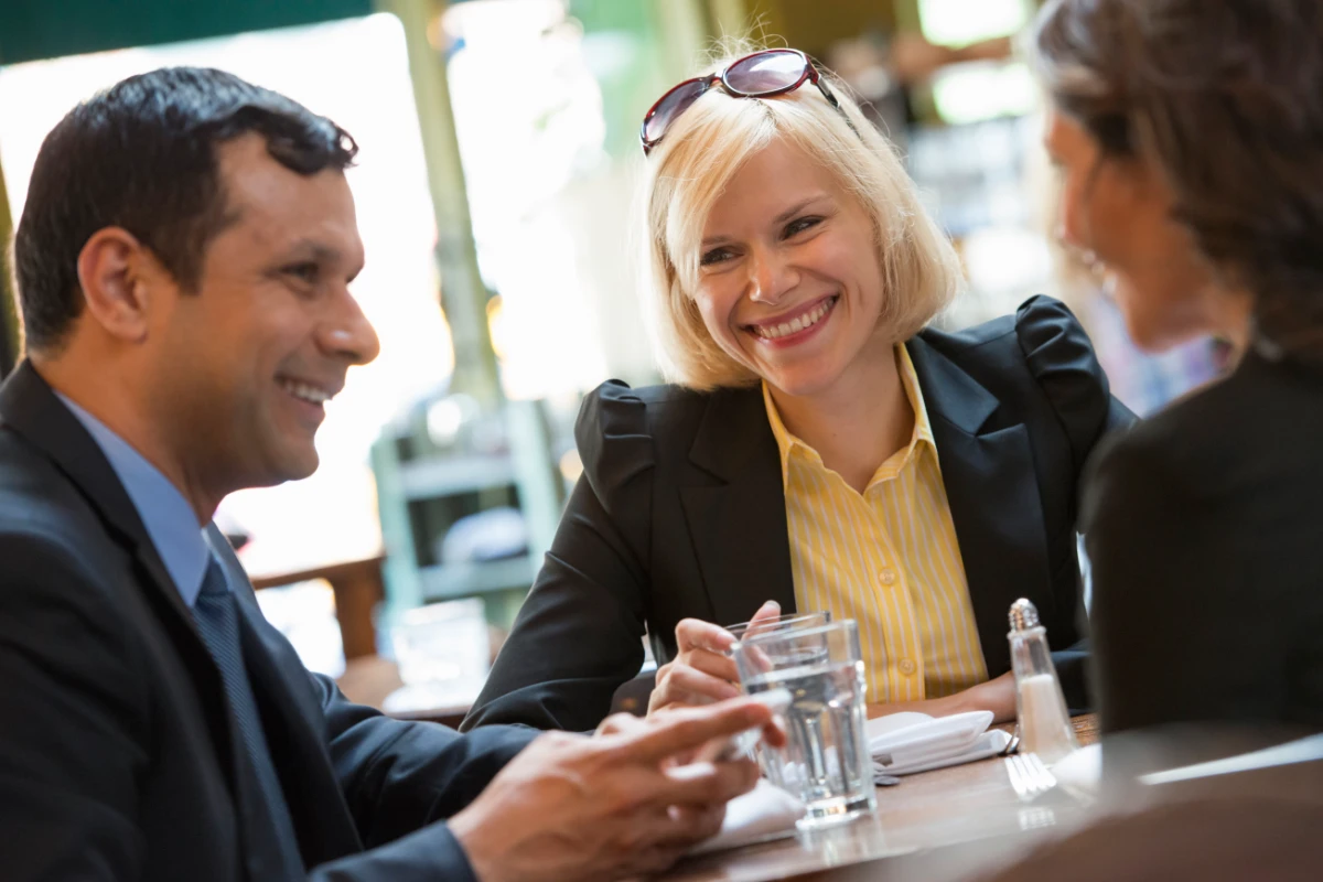 Business professionals talking together during an informal meeting