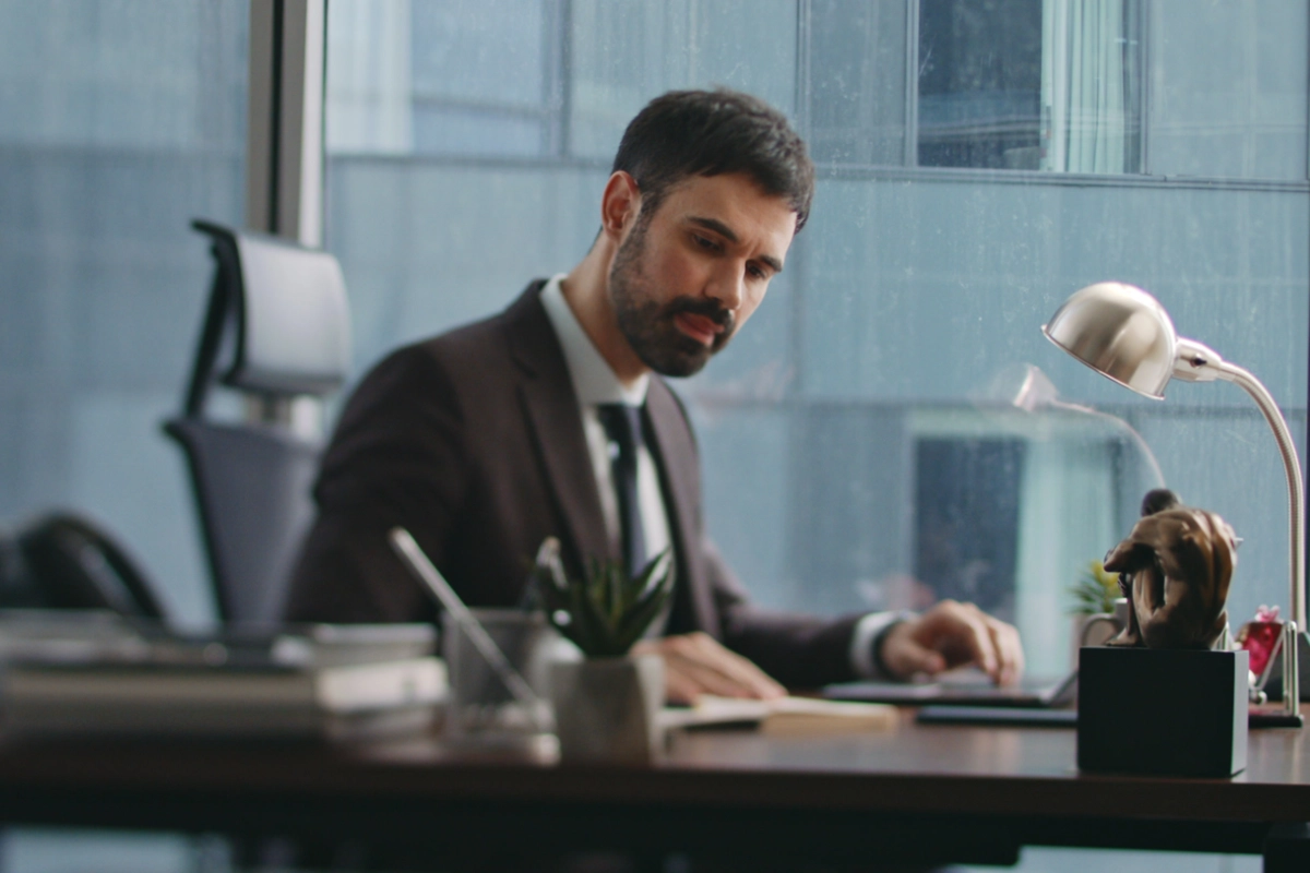Business professional working at a desk in a modern office