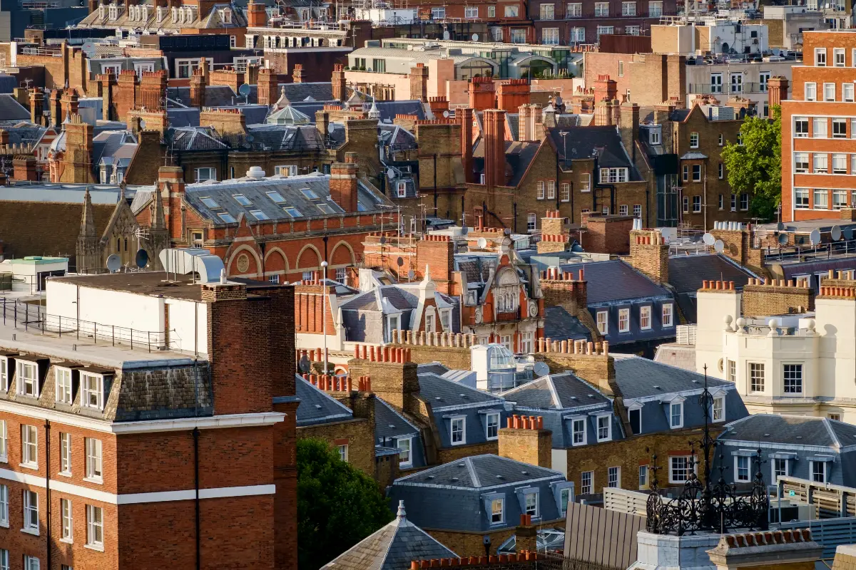 Dense London cityscape with traditional brick buildings and rooftops
