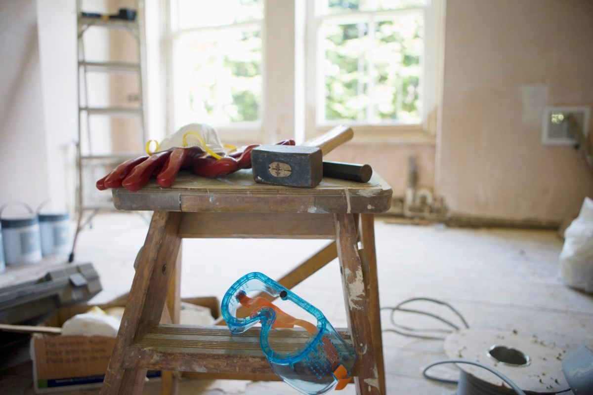 Renovation tools and safety equipment inside a property undergoing refurbishment