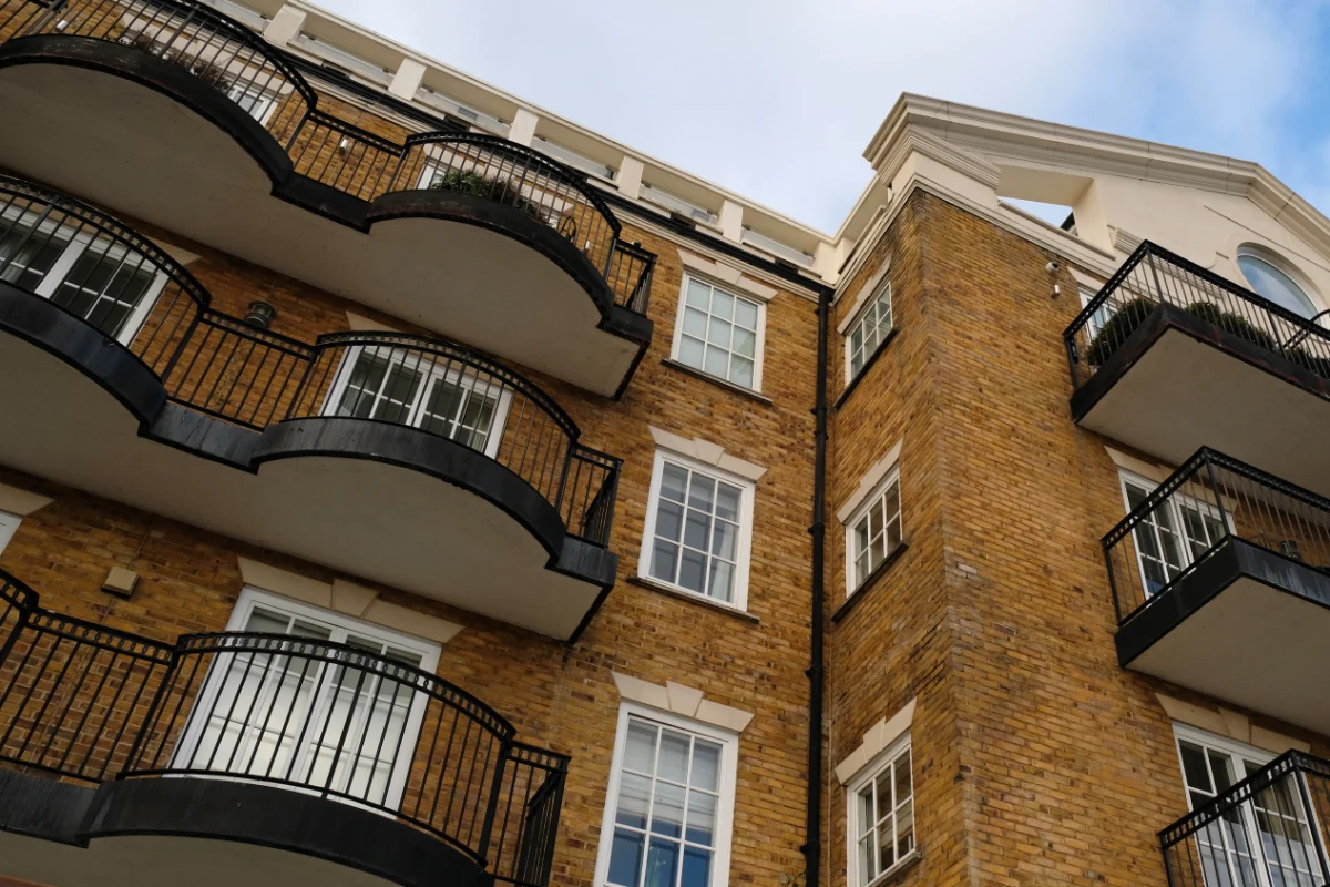 Brick apartment building exterior with curved balconies