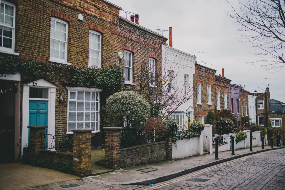 Row of traditional brick terraced houses on a residential street