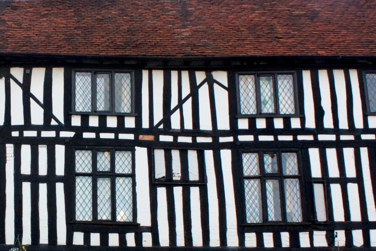 Traditional timber-framed building with leaded windows and tiled roof